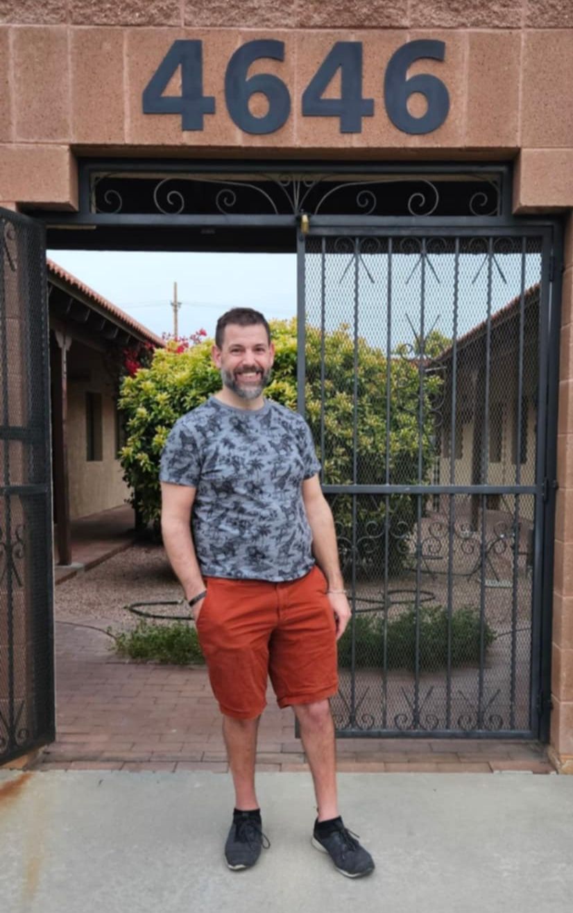 Dr. Clint Mausser outside the entrance of the Central office at 4646 E Fort Lowell Rd