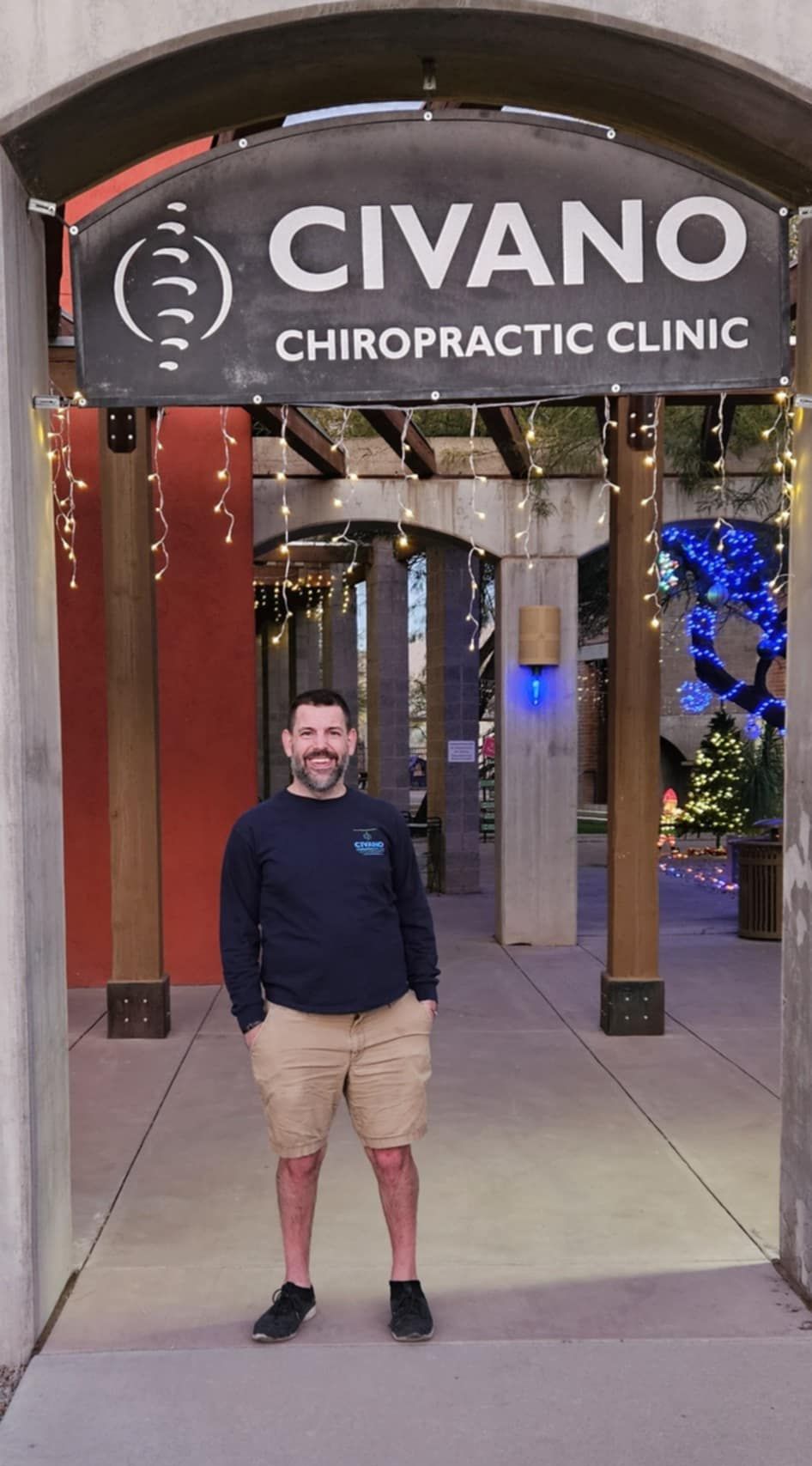 Dr. Clint Mausser standing at the entrance of Civano Chiropractic Clinic